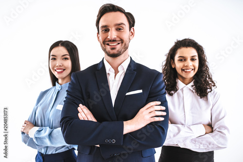The three business people standing on the white background