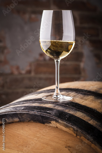 Bild auf Leinwand White wine on a barrel