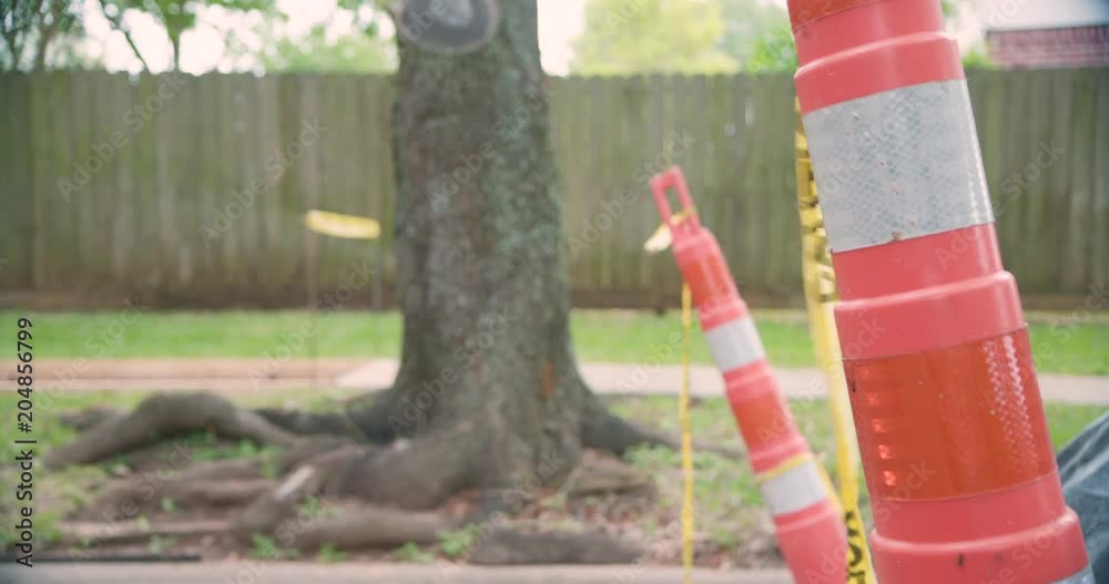 closeup of a caution pole in a street construction zone closeup of a caution pole in a street construction zone