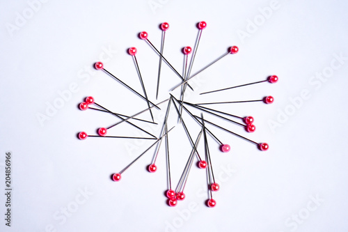 Foto Needle pin pink on white background