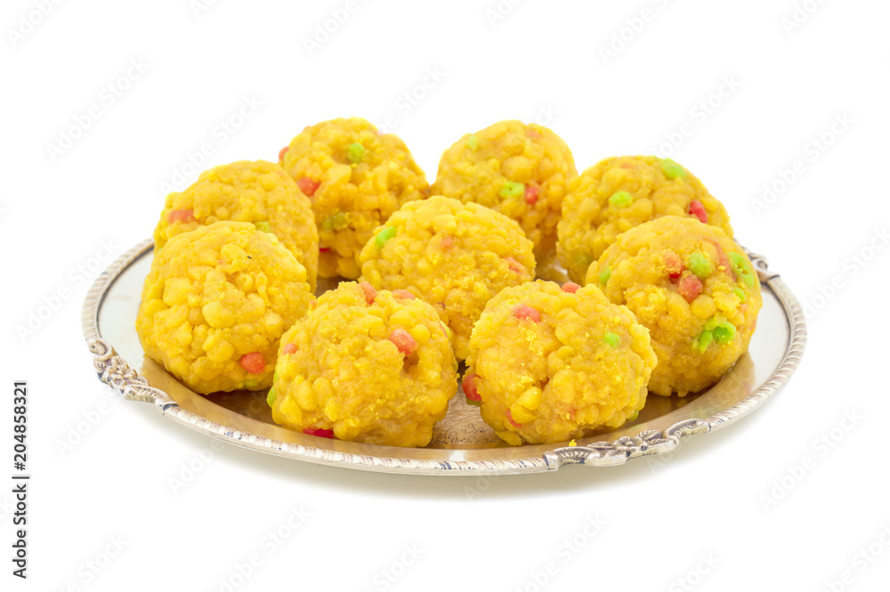 Laddu also know as laddoo, ladoo, laddo are ball-shaped sweets popular in the Indian festivals. Laddu are made of flour, minced dough and sugar with other ingredients. laddu on white background Laddu also know as laddoo, ladoo, laddo are ball-shaped sweets popular in the Indian festivals. Laddu are made of flour, minced dough and sugar with other ingredients. laddu on white background
