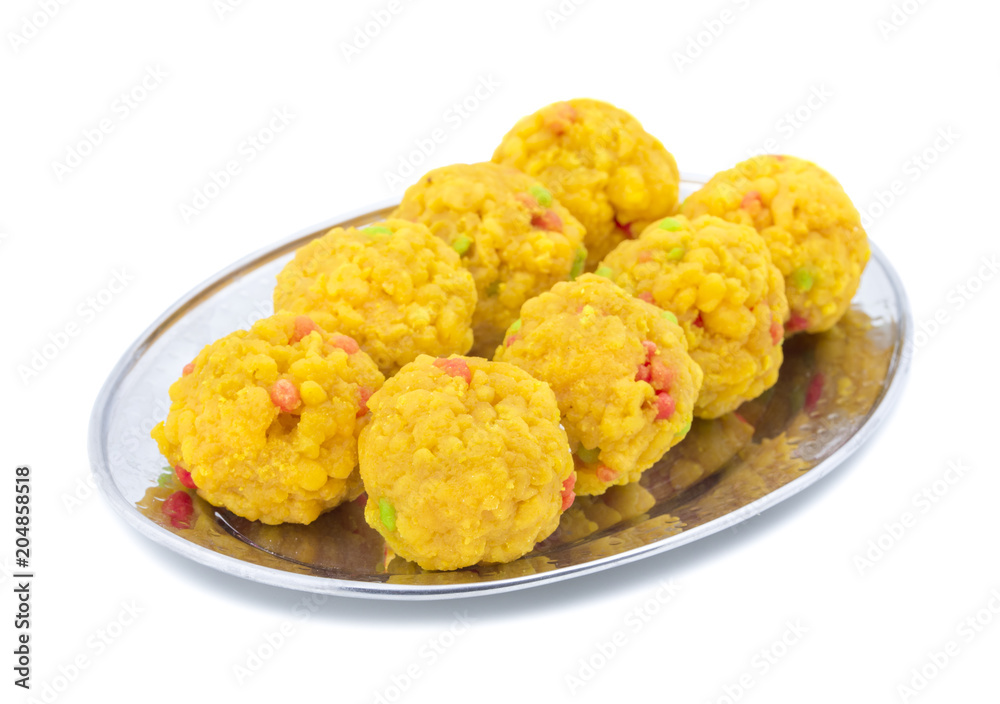 Laddu also know as laddoo, ladoo, laddo are ball-shaped sweets popular in the Indian festivals. Laddu are made of flour, minced dough and sugar with other ingredients. laddu on white background Laddu also know as laddoo, ladoo, laddo are ball-shaped sweets popular in the Indian festivals. Laddu are made of flour, minced dough and sugar with other ingredients. laddu on white background