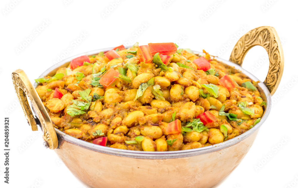 Indian Cuisine Rajma Masala or Rajmah is a South Asian Vegetarian Dish Consisting of White Kidney Beans in a thick gravy with many Indian whole spices and usually served with Chapati and food Indian Cuisine Rajma Masala or Rajmah is a South Asian Vegetarian Dish Consisting of White Kidney Beans in a thick gravy with many Indian whole spices and usually served with Chapati and food