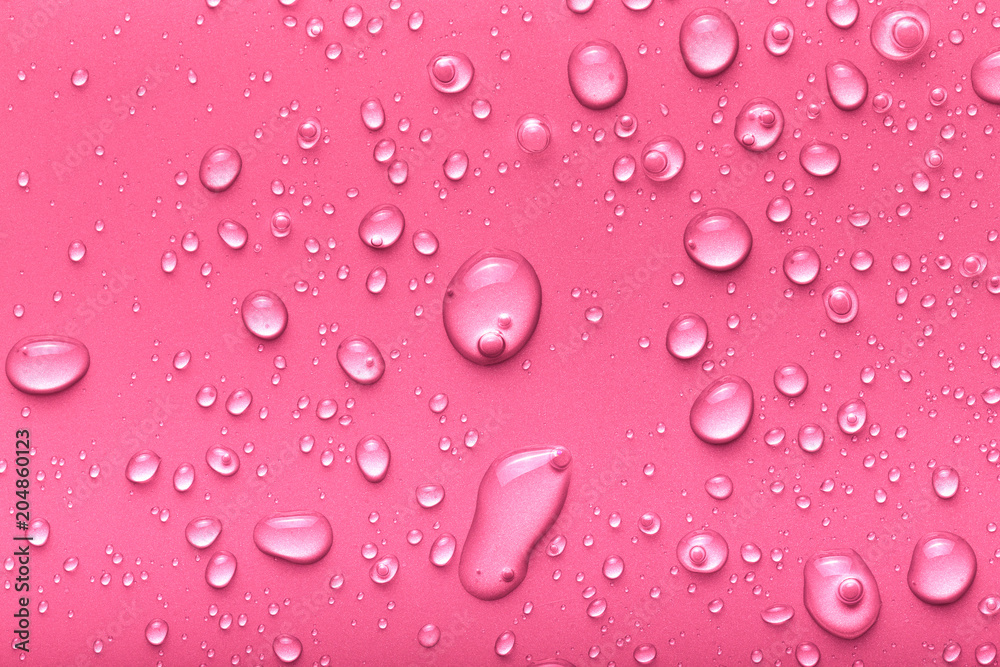 Drops of water on a color background. Pink. Toned Drops of water on a color background. Pink. Toned