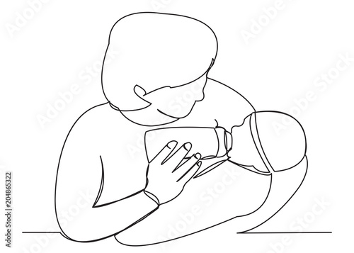 mom feeds a newborn from a bottle05