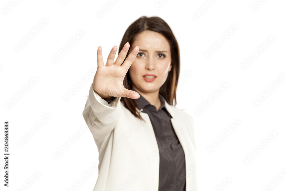 Businesswoman showing stop hand on white baclground Businesswoman showing stop hand on white baclground