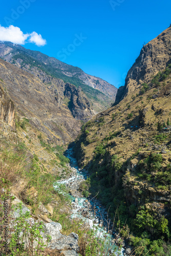 Mountain landscape with a deep gorge in the Himalayas.