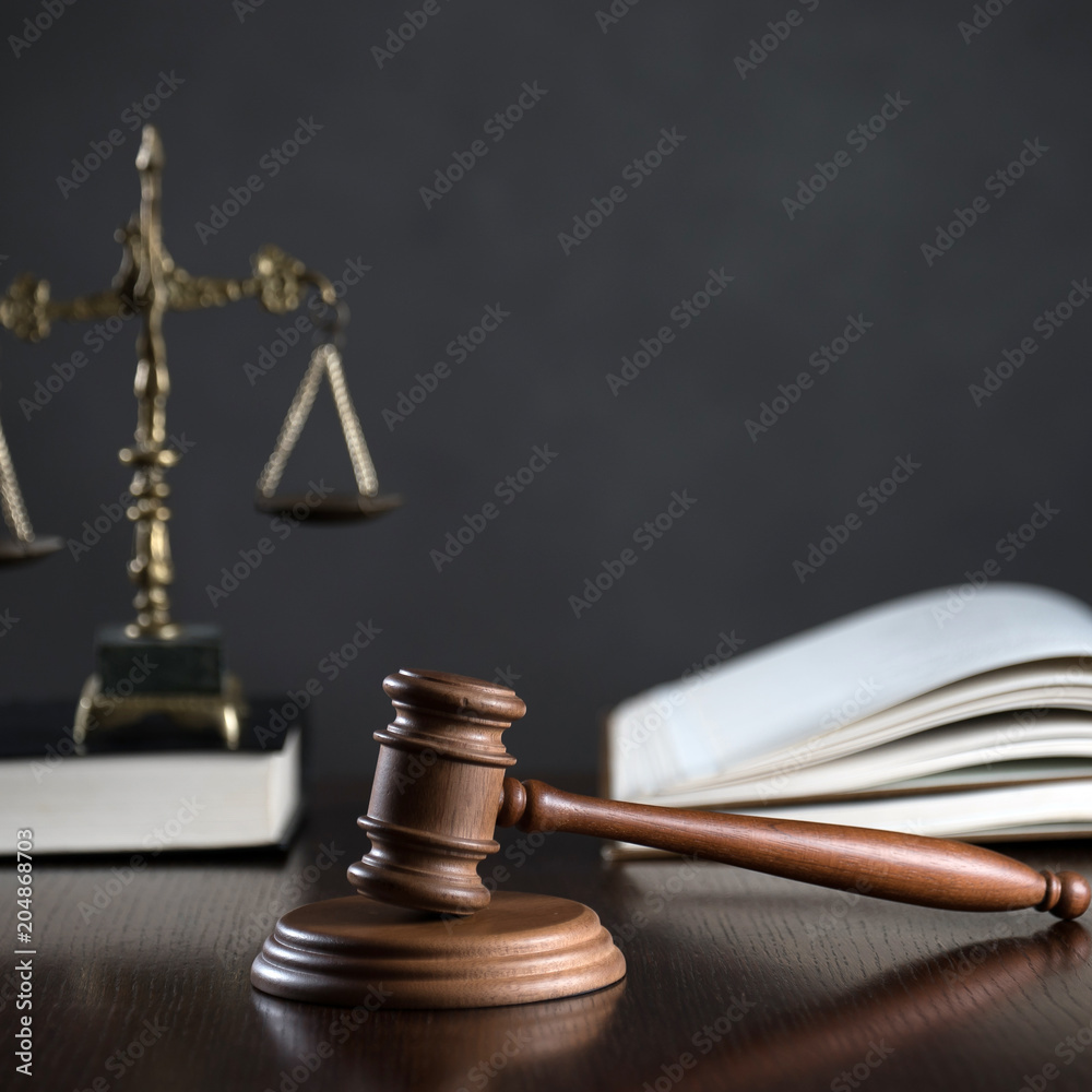 Law theme, mallet of the judge, wooden desk, books Law theme, mallet of the judge, wooden desk, books