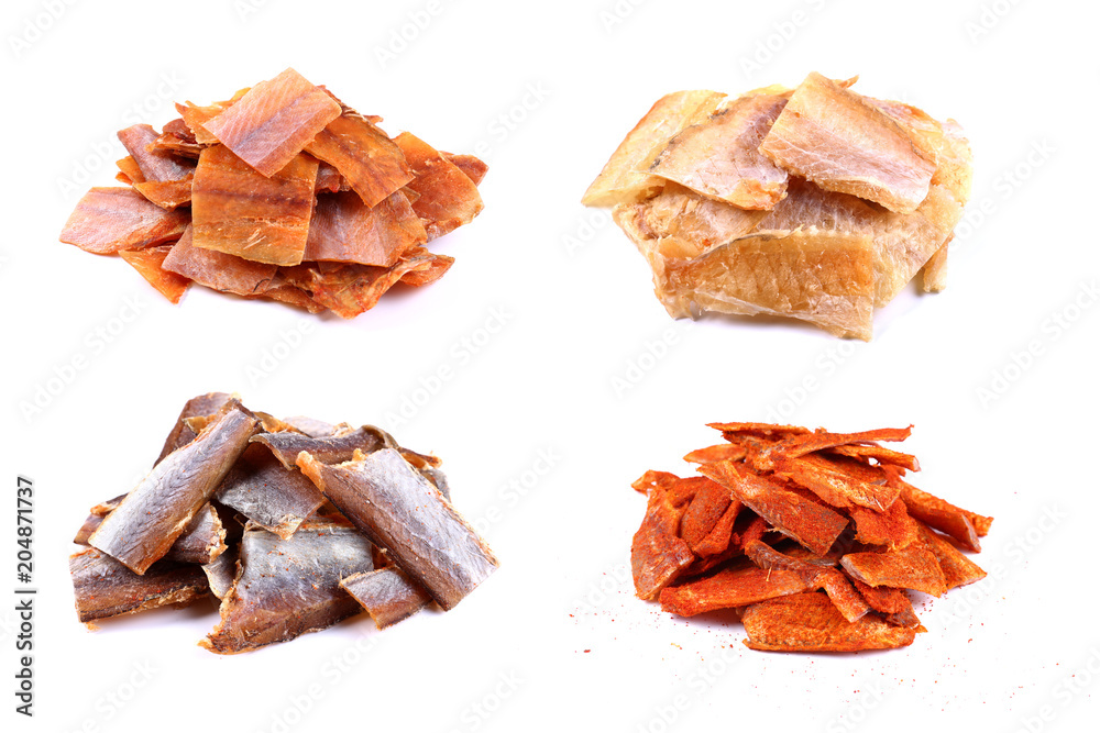 Pieces of Red Cod Fish on a white background (isolated). Snack to beer. Close up Pieces of Red Cod Fish on a white background (isolated). Snack to beer. Close up