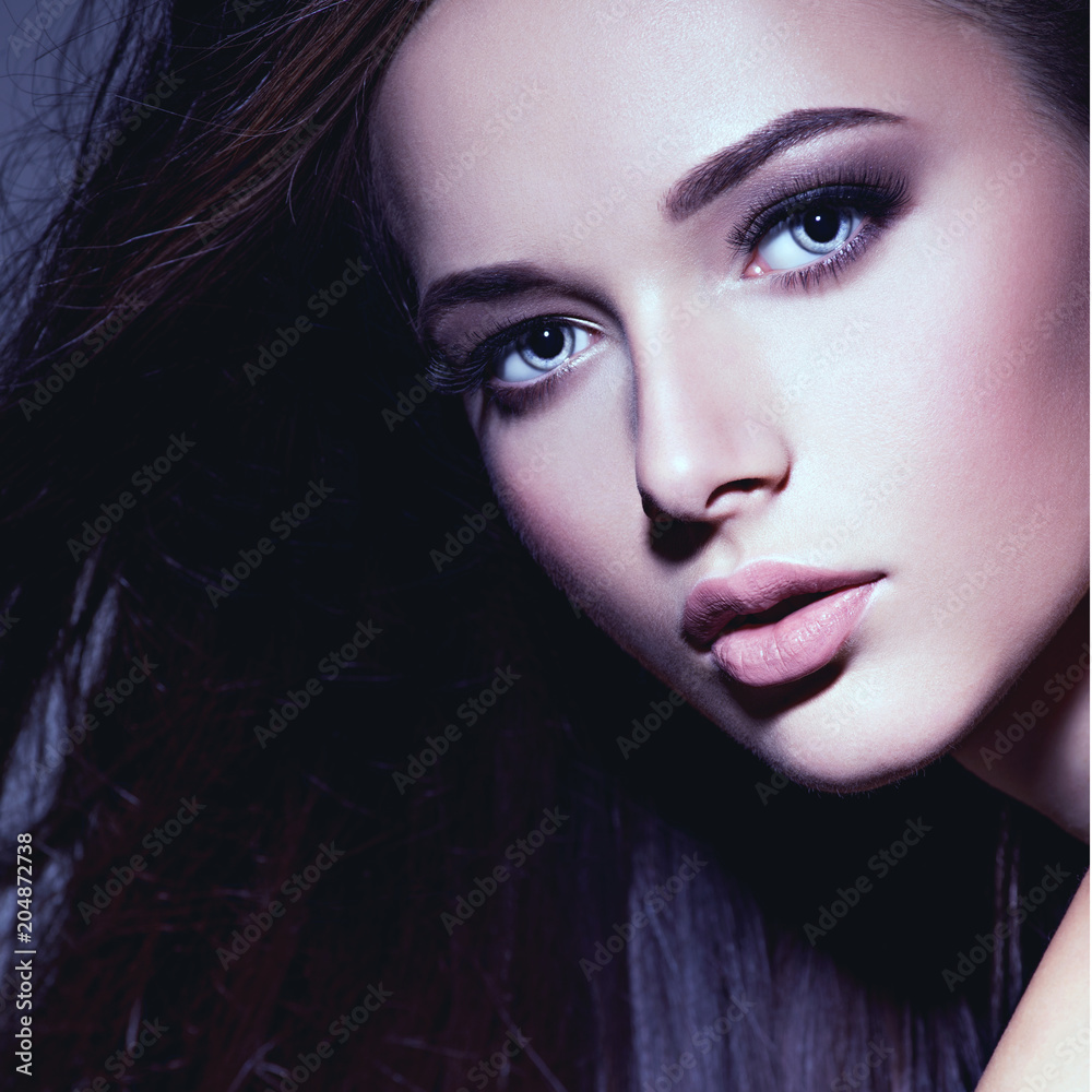 Portrait of the beautiful young woman with long brown hair Portrait of the beautiful young woman with long brown hair