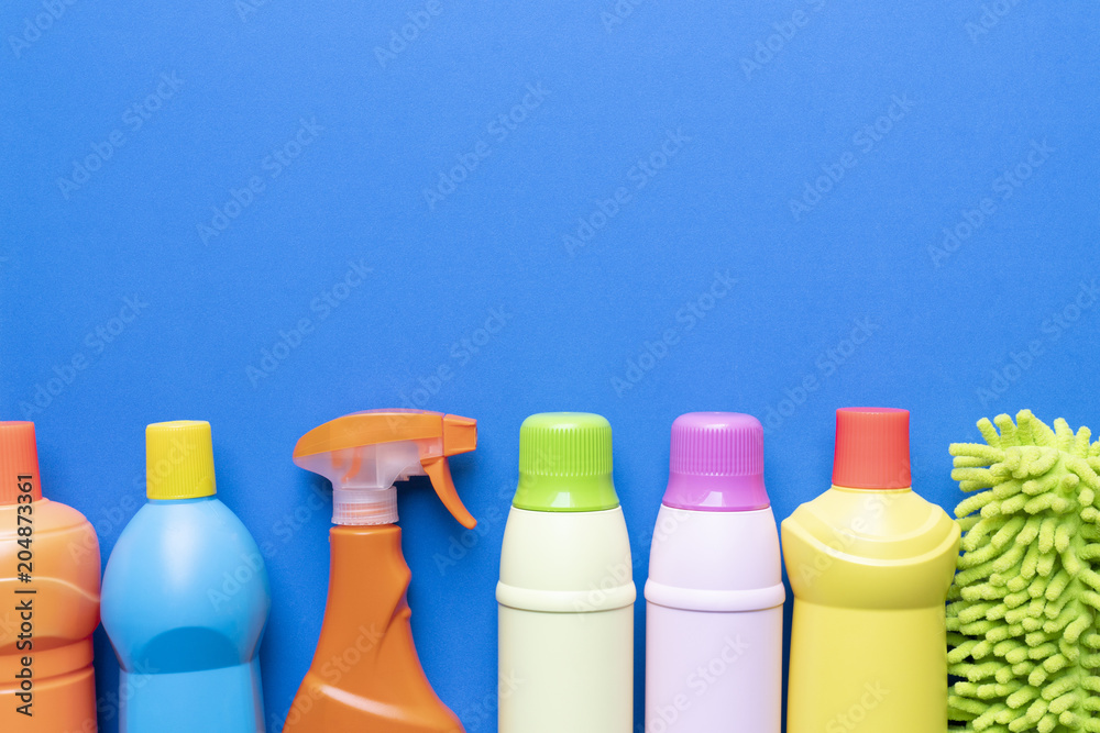 House cleaning product on blue background, flat lay