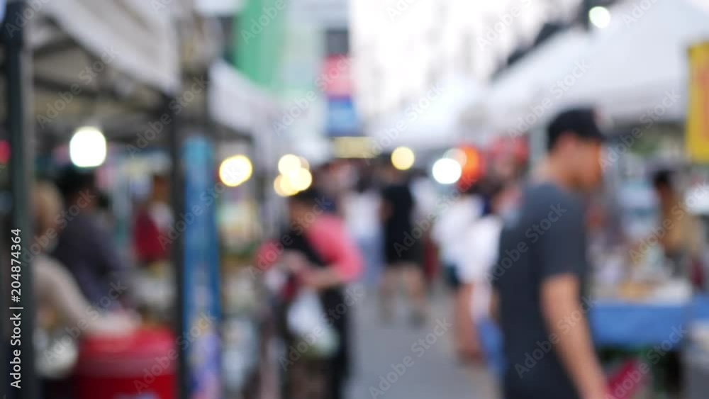 blur scene slow motion people walking shopping in street market blur scene slow motion people walking shopping in street market