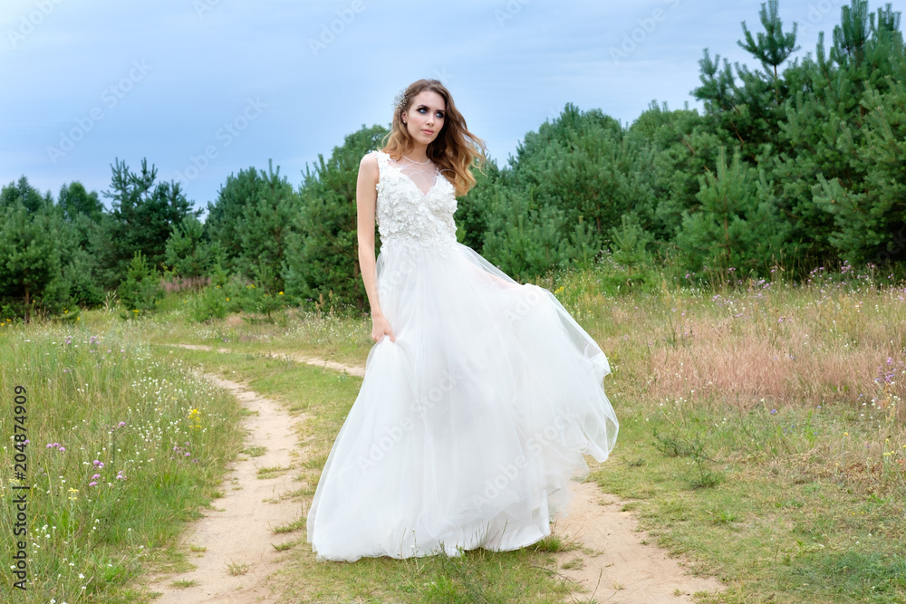 young pretty bride in white wedding dress outdoors, make up and hairstyle young pretty bride in white wedding dress outdoors, make up and hairstyle