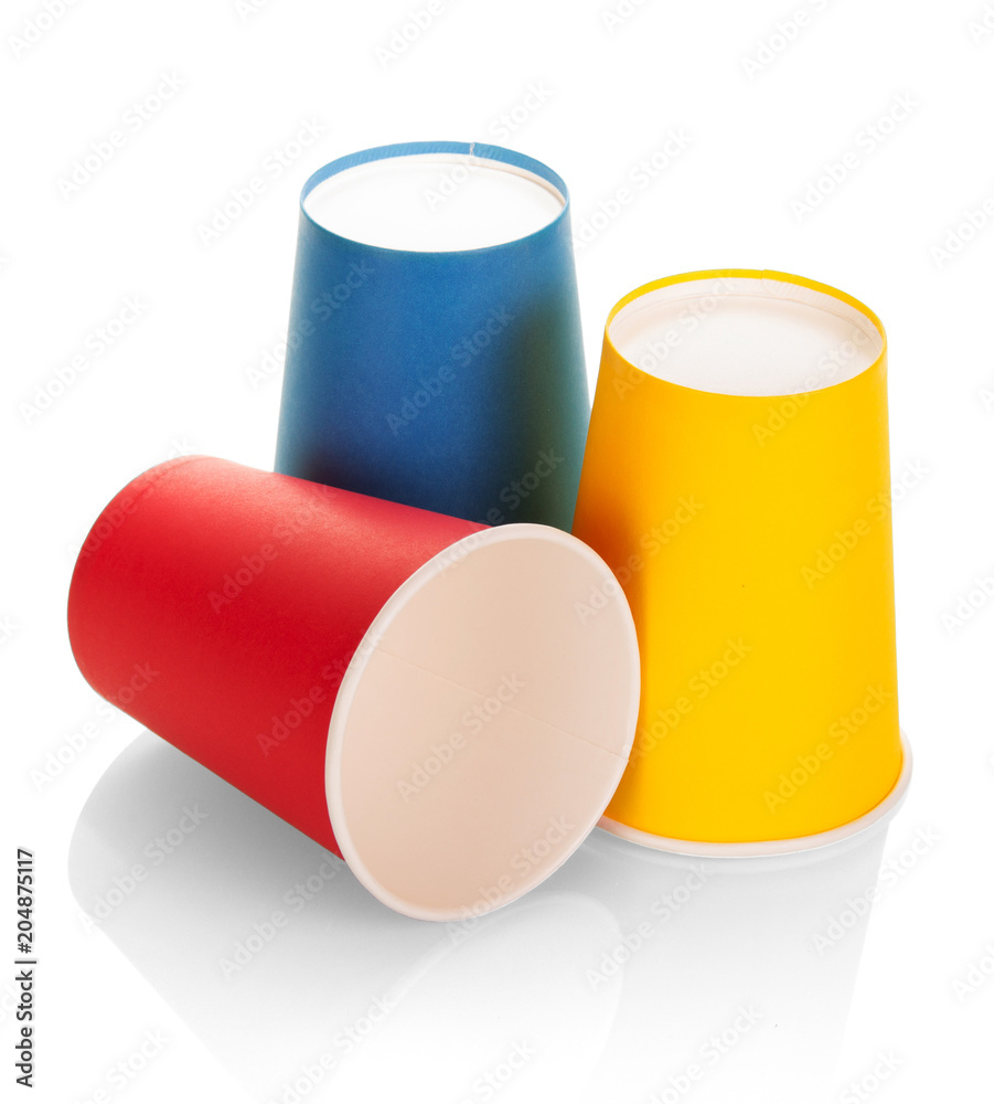 Three multi colored disposable plastic cups isolated on white Three multi colored disposable plastic cups isolated on white