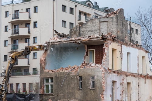 Residential building demolition with excavator © nevodka.com
