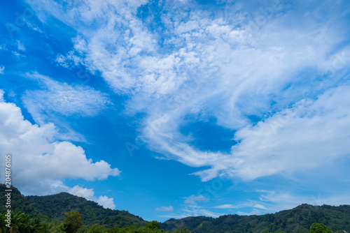  Cloud in blue sky .Fluffy cloud in summer season  over the mountain daytime.