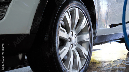  Wash car wheels with a high-pressure device © dkHDvideo