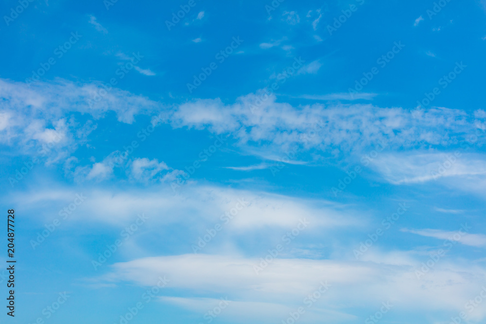 Clouds on a blue sky as a background Clouds on a blue sky as a background