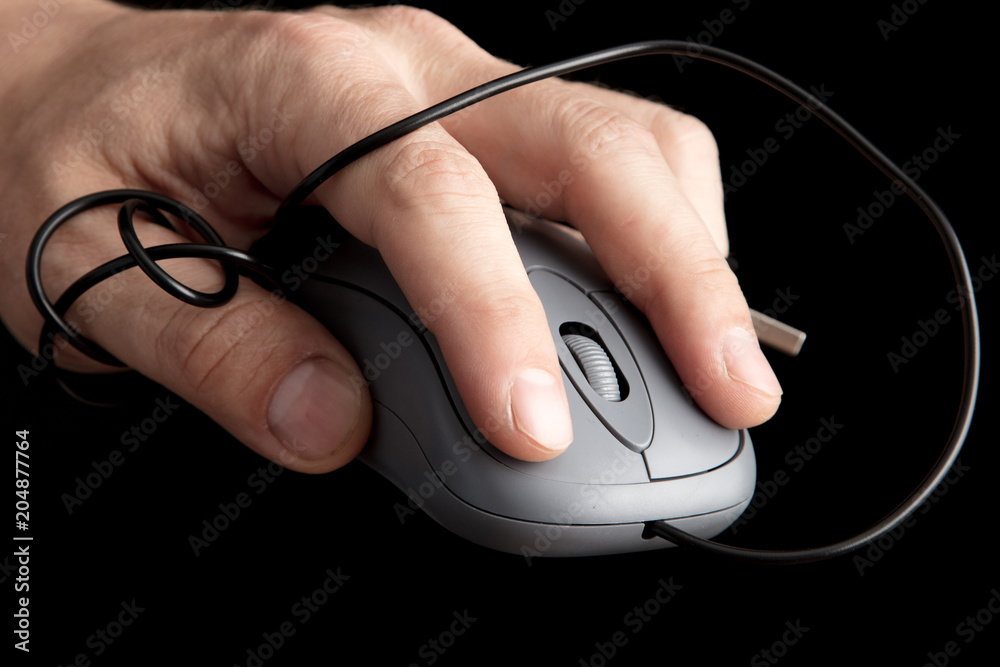 Mouse from computer in hand on black background Mouse from computer in hand on black background