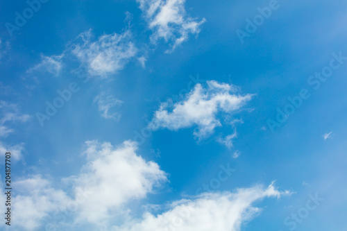 Clouds on a blue sky as a background