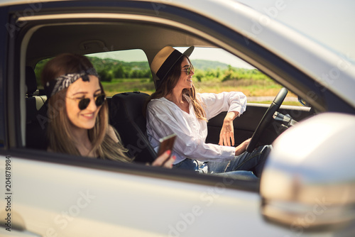 Two young women having fun on road trip © chika_milan