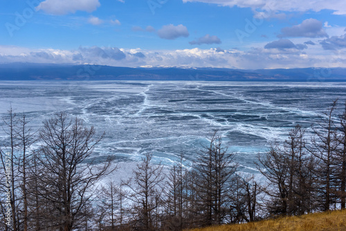 Ice on Lake Baikal  and cliffs of Cape Khoboy photo