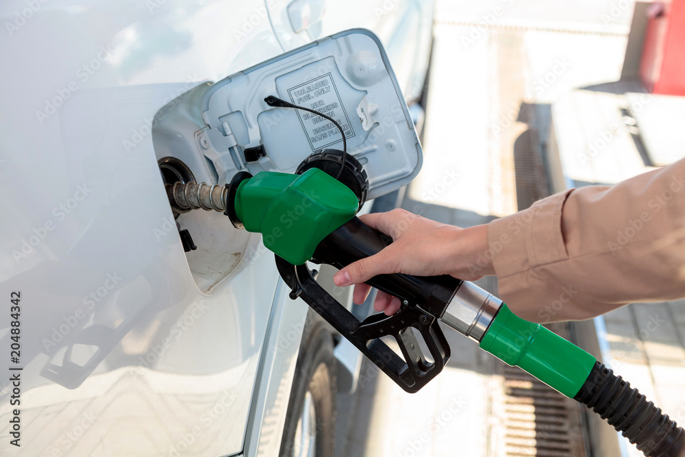 Woman at the gas pump station Woman at the gas pump station
