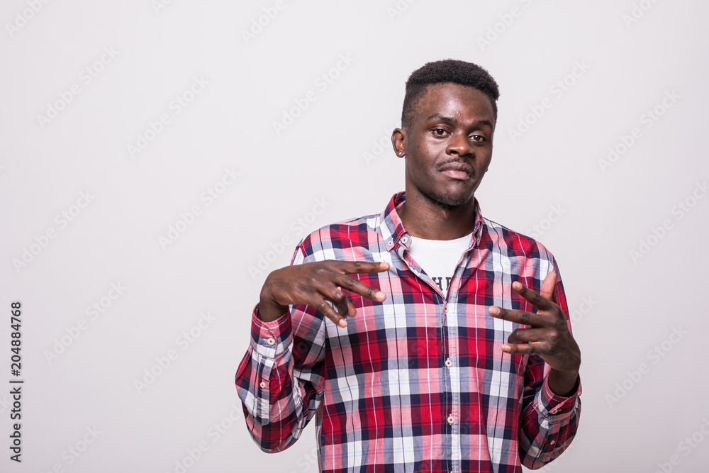 Wazzup man. Attractive young dark-skinned man, gesticulating with hands having fun. Wazzup man. Attractive young dark-skinned man, gesticulating with hands having fun.