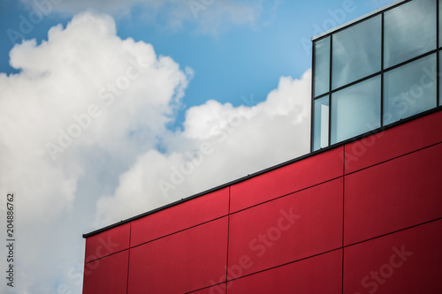 a part of the red building against the sky