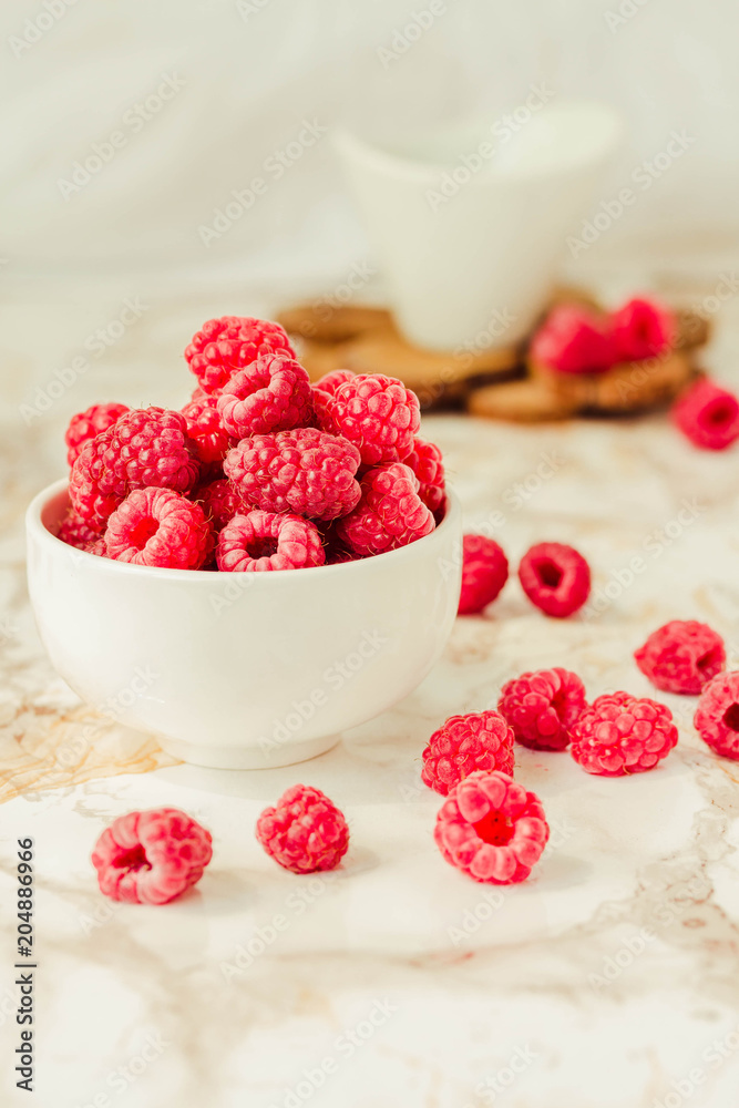 Raw raspberries and wild black, blackberries in white cups. Light marble background. Summer fruit, berries. Detox diets and healthy food concept. Raw raspberries and wild black, blackberries in white cups. Light marble background. Summer fruit, berries. Detox diets and healthy food concept.