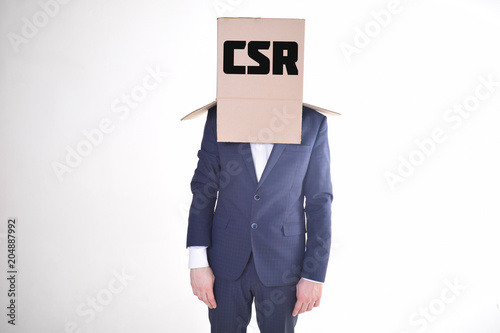 The businessman is holding a box with the inscription:CSR