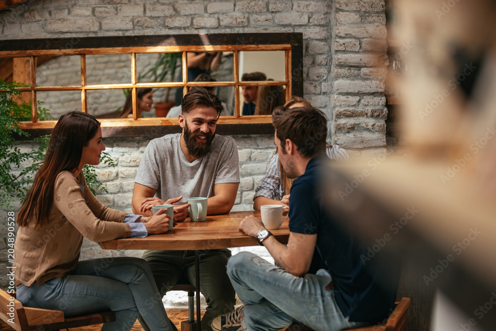 Fototapeta premium Friends enjoying a coffee together