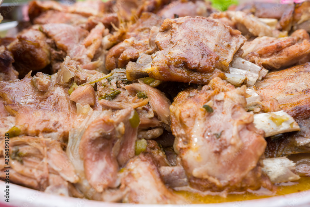 Lamb meat - roasted ribs with green, fresh onion and mint in an oven. Close up, selective focus. Lamb meat - roasted ribs with green, fresh onion and mint in an oven. Close up, selective focus.