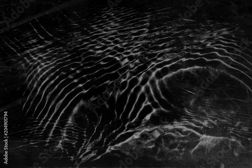 Black Gray Water Surface Background in Grunge Style.  Scratched Vintage Effect Noise Grain Dark Design