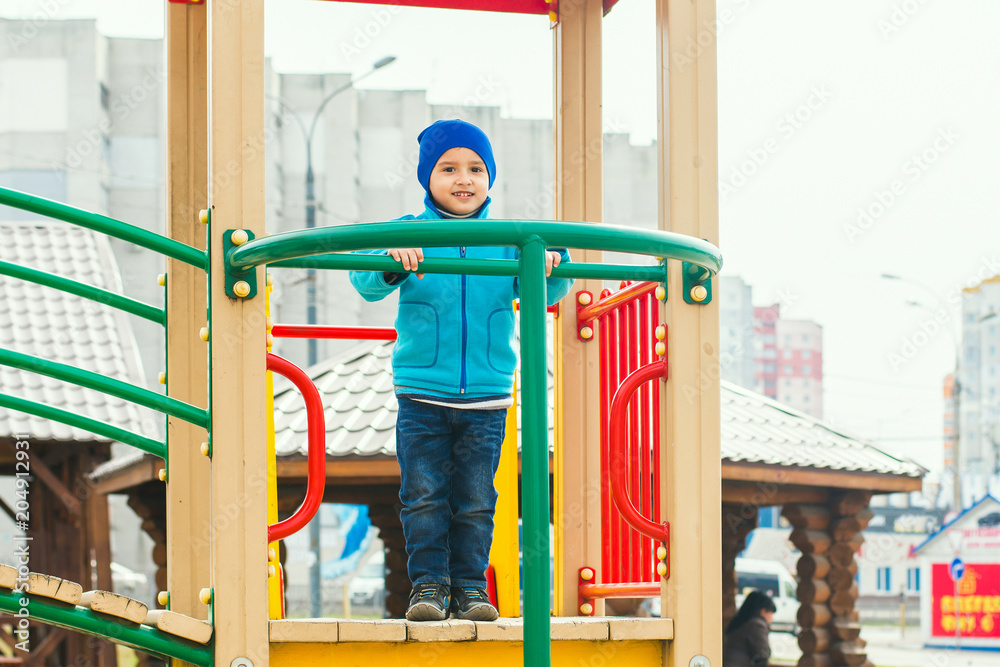 boy plays on the Playground