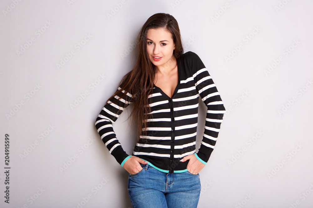 beautiful young woman in striped sweater beautiful young woman in striped sweater