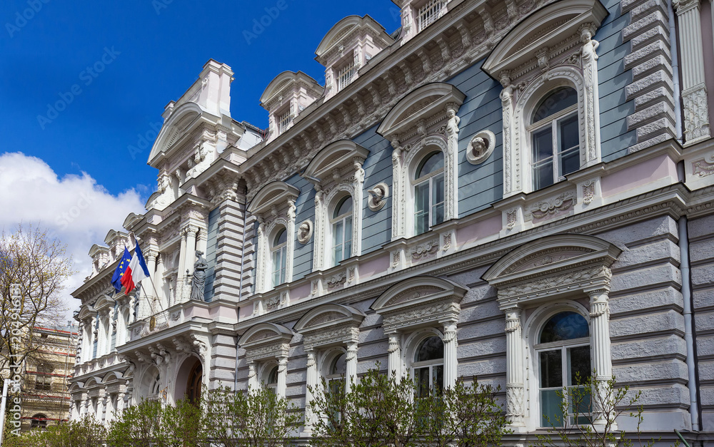 Riga, Latvia. Embassy Of France In Latvia. Facade Of Building Under Blue Clear Sky. Riga, Latvia. Embassy Of France In Latvia. Facade Of Building Under Blue Clear Sky.