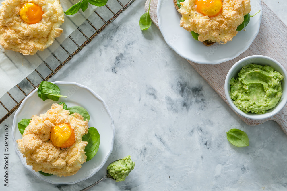 Trendy healthy eating concept - egg clouds on toasts Trendy healthy eating concept - egg clouds on toasts