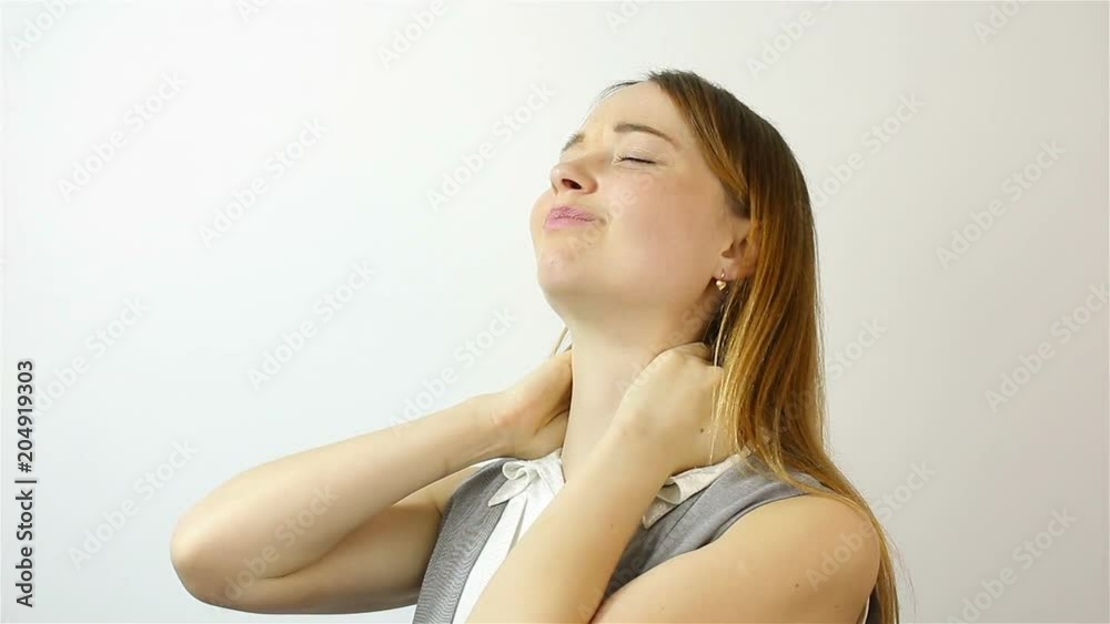 Young woman with pain in the neck joint Young woman with pain in the neck joint