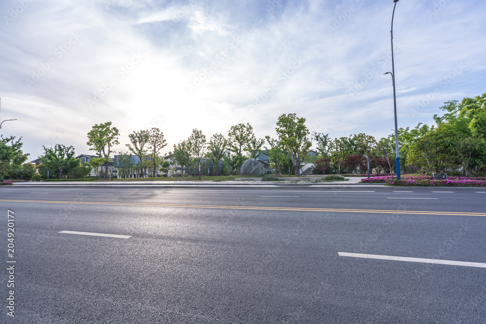 empty road with modern office building empty road with modern office building