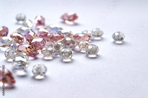 Crystal beads on white background. Closeup shot