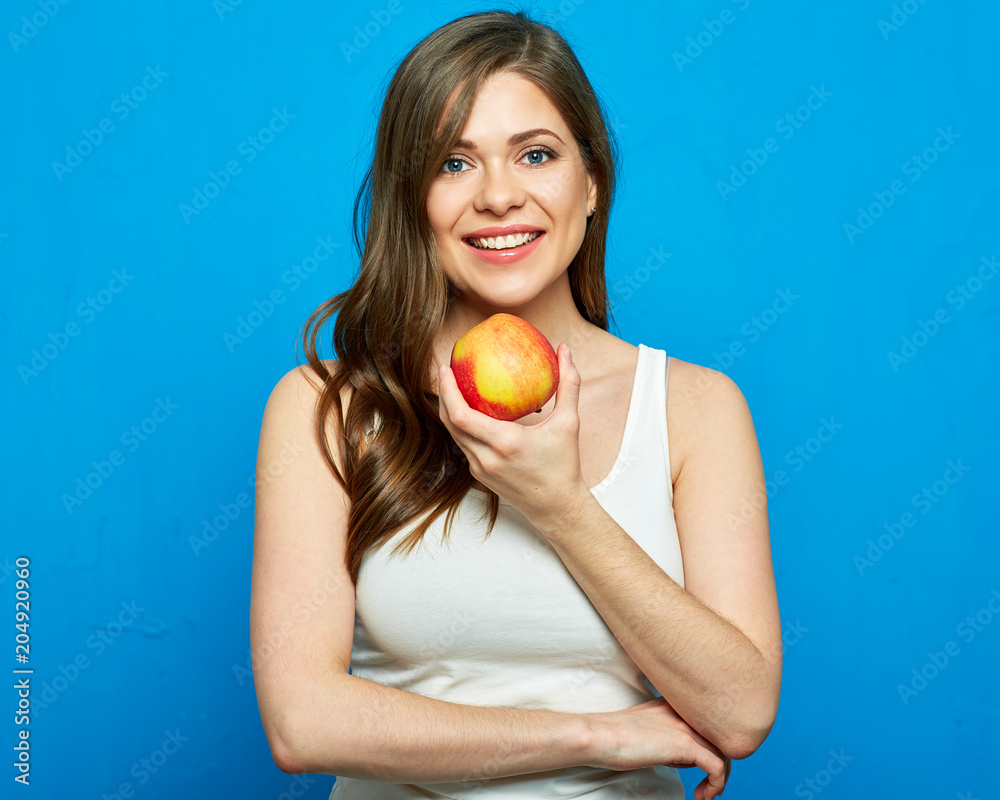 Smiling girl holding red apple. Smiling girl holding red apple.