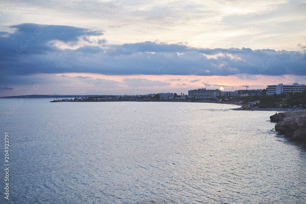 Sunset near the picturesque sea coast. Peace and beauty concept Sunset near the picturesque sea coast. Peace and beauty concept