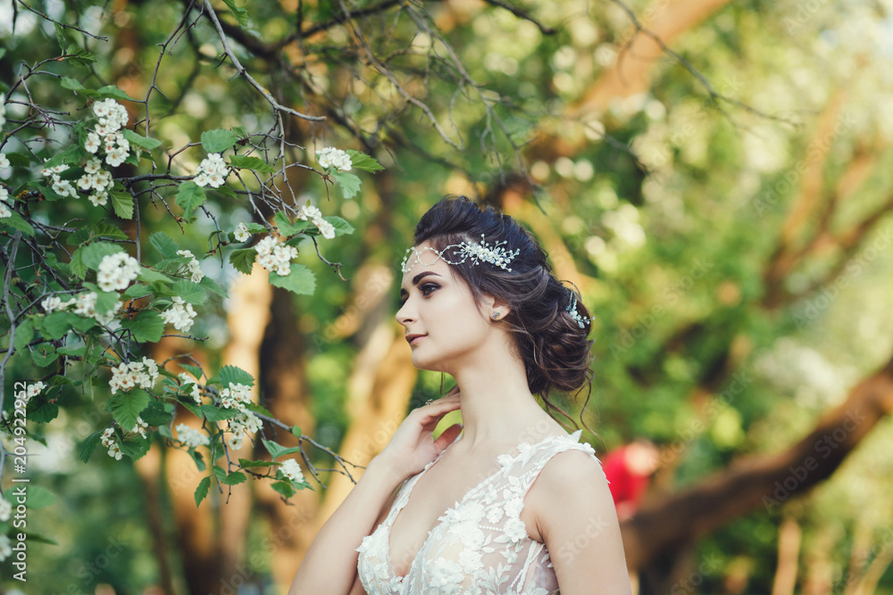 Portrait beautiful bride outdoors in spring park Portrait beautiful bride outdoors in spring park