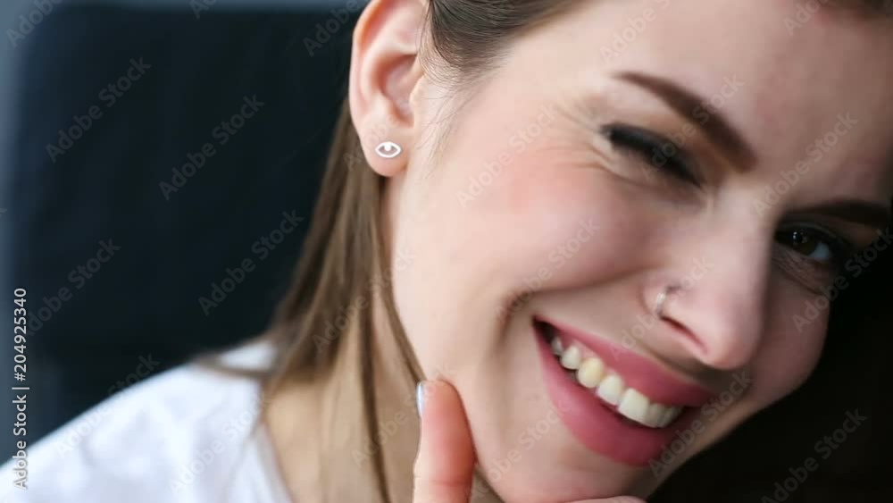 Young woman sitting near the window Young woman sitting near the window