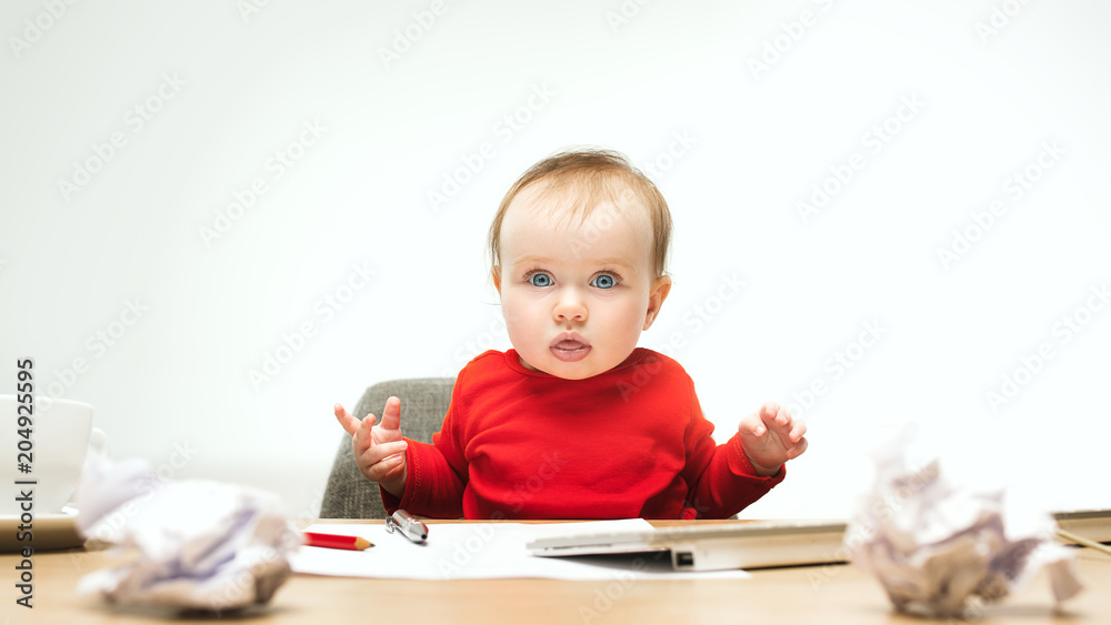 Happy child baby girl toddler sitting with keyboard of computer isolated on a white background Happy child baby girl toddler sitting with keyboard of computer isolated on a white background