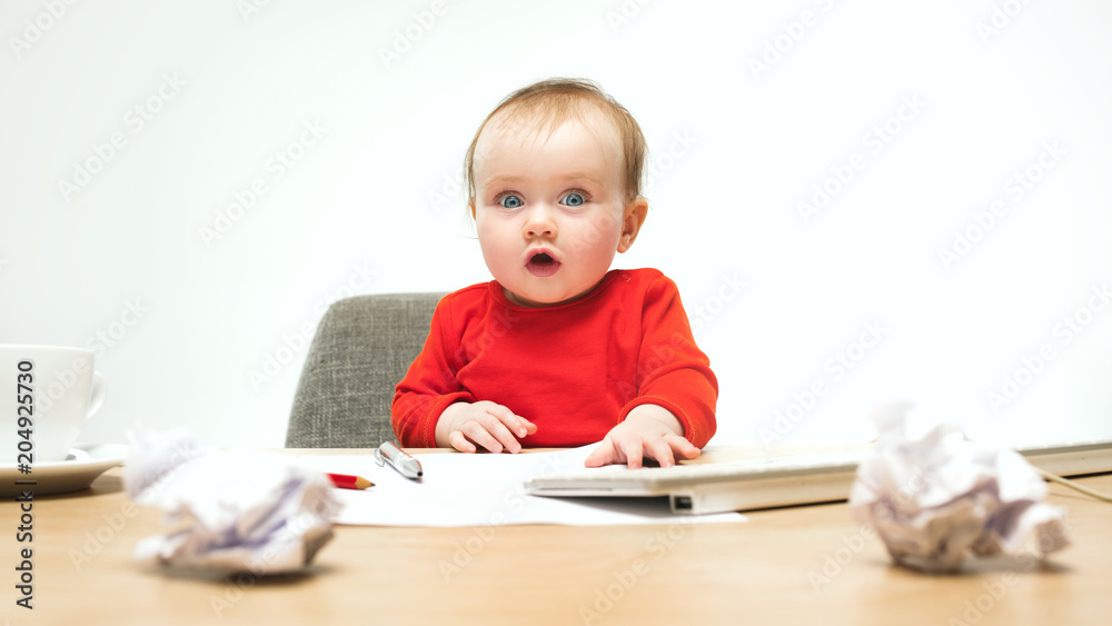 Happy child baby girl toddler sitting with keyboard of computer isolated on a white background Happy child baby girl toddler sitting with keyboard of computer isolated on a white background