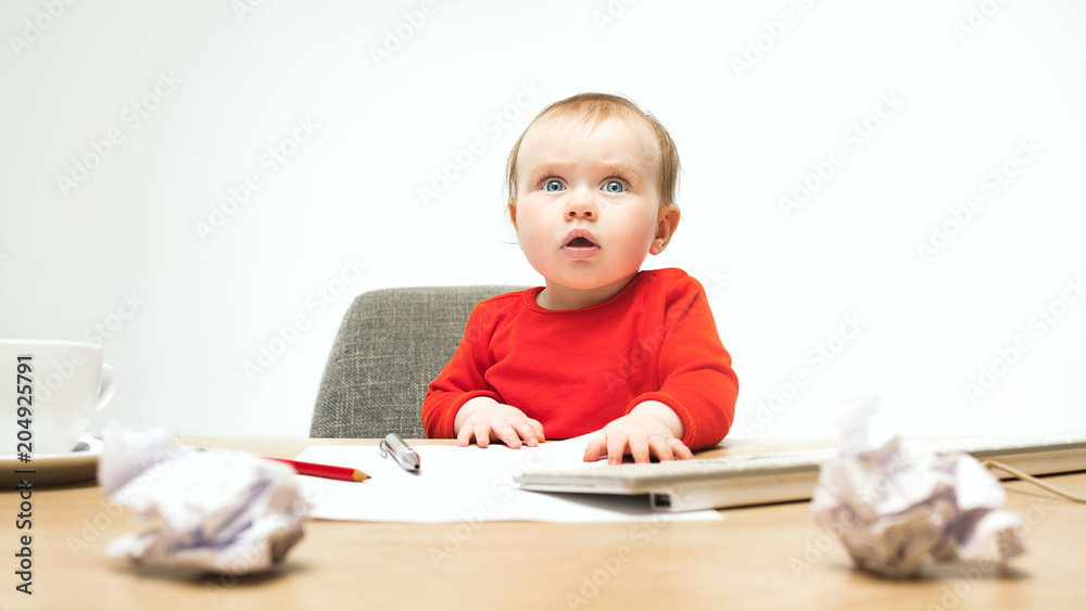 Happy child baby girl toddler sitting with keyboard of computer isolated on a white background Happy child baby girl toddler sitting with keyboard of computer isolated on a white background