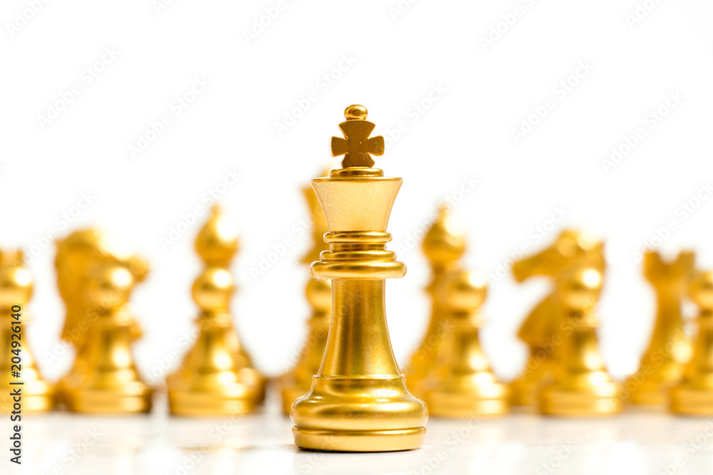 Gold king chess piece stand in front of team on white background (Concept for leadership, management) Gold king chess piece stand in front of team on white background (Concept for leadership, management)