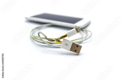 unsafe cable Phone Charger Lack of damage on white background   © piyaphunjun